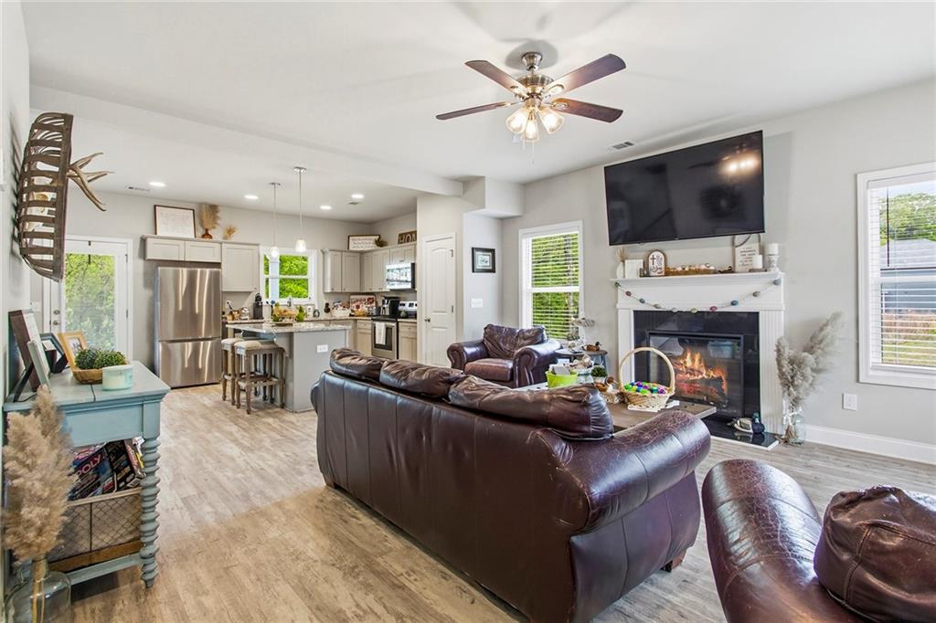 171 Strickland Loop Forsyth, GA 31029 - Photo 7 of 25 a living room with furniture fireplace and a flat screen tv