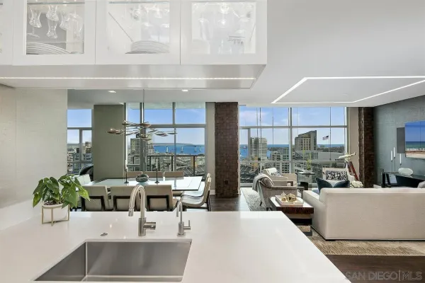 a kitchen with kitchen island a sink stove and refrigerator
