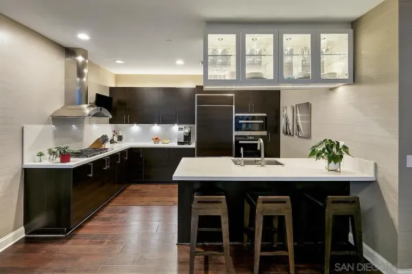 a kitchen with stainless steel appliances a refrigerator and a stove