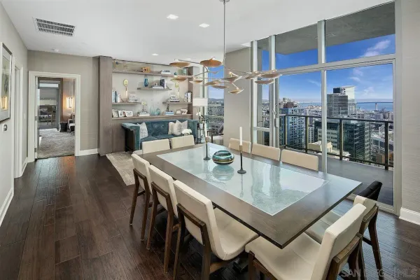 a kitchen with stainless steel appliances granite countertop a sink a stove and a wooden cabinets