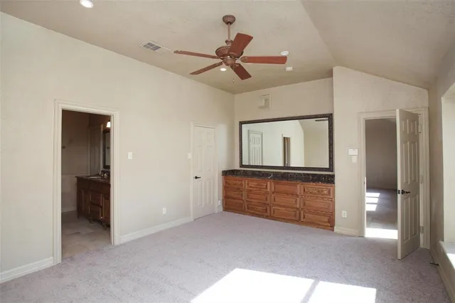 a room with closet and mirror