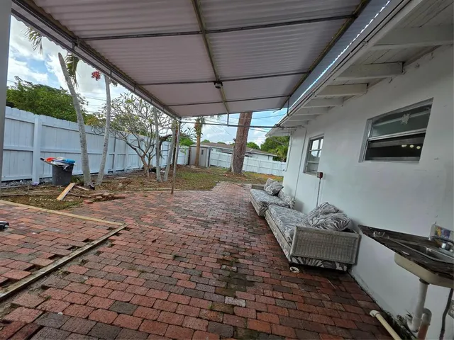 a backyard of a house with seating space