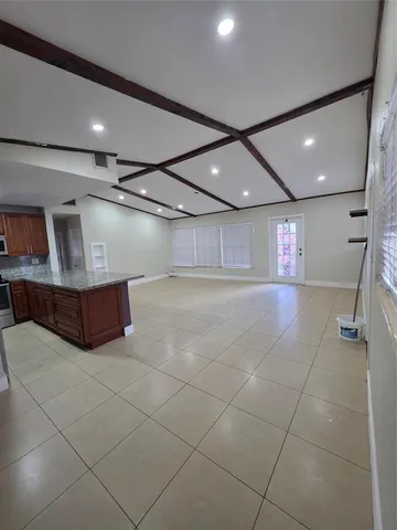 a big room with gym equipment