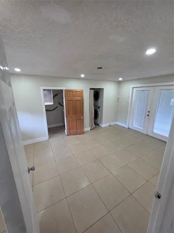 a view of an empty room with a fireplace