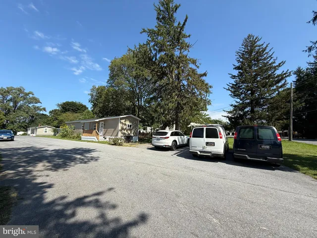 a view of street with parked cars