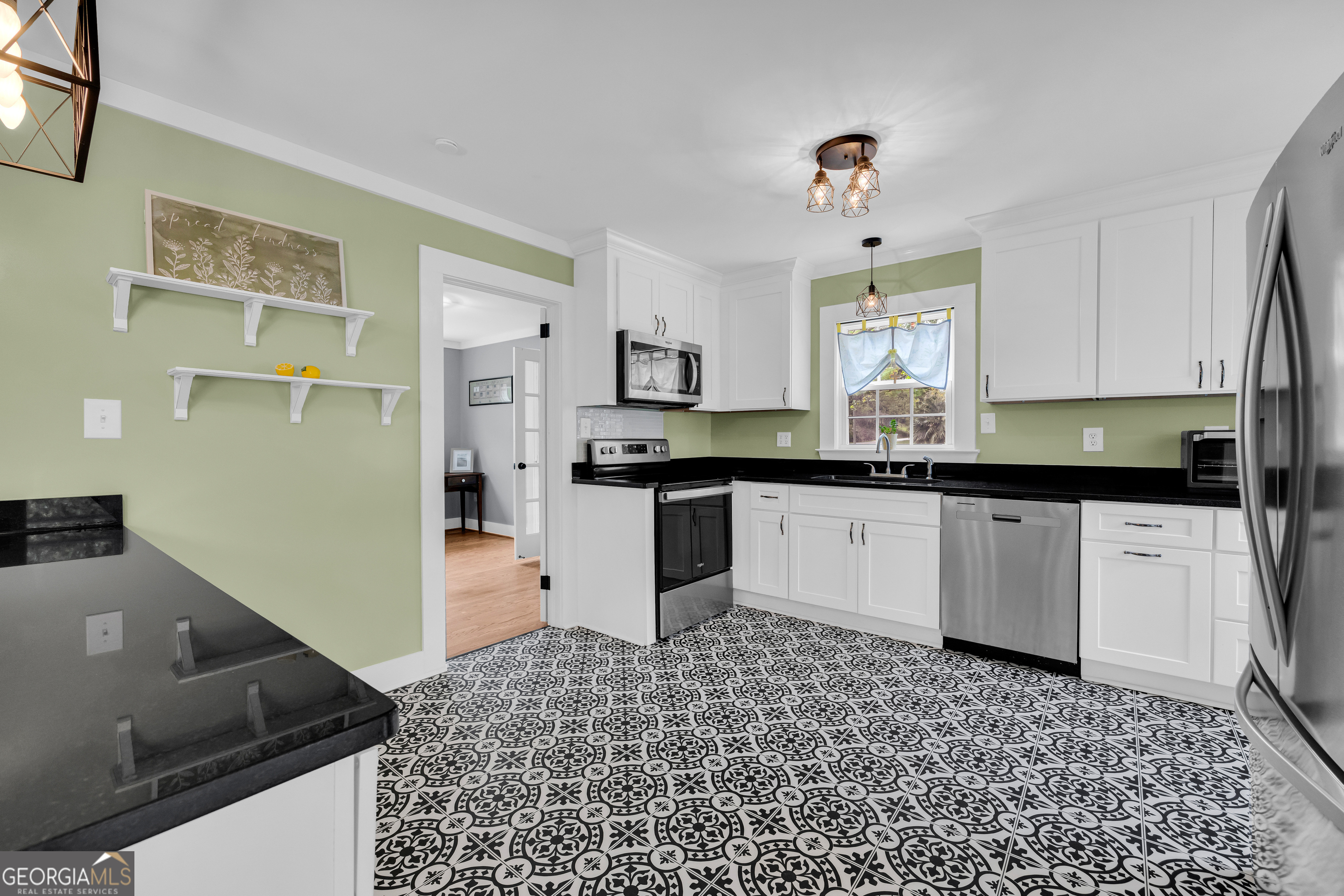 261 Oak Valley Road Toccoa, GA 30577 - Photo 13 of 52 a kitchen with granite countertop a sink and cabinets