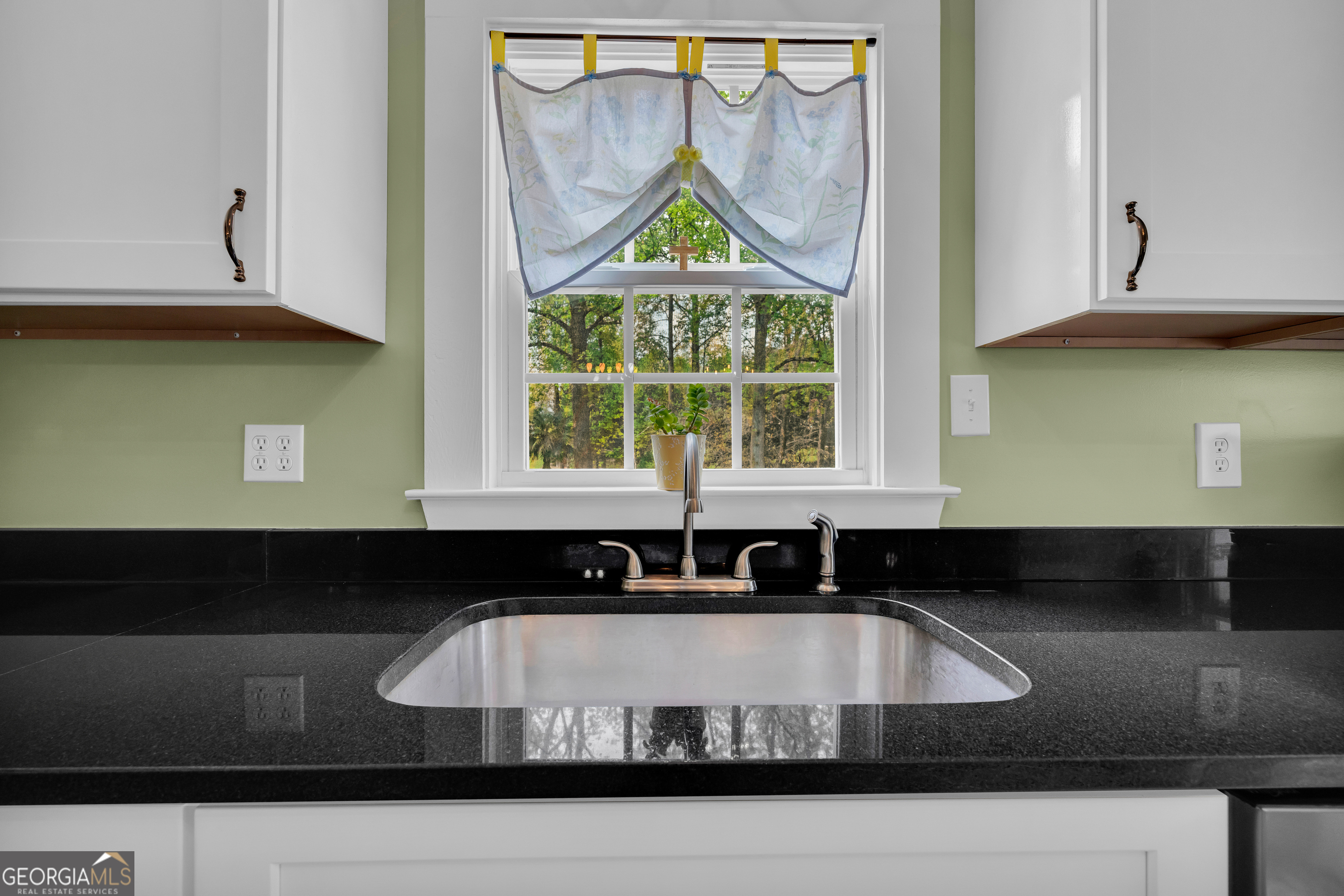 261 Oak Valley Road Toccoa, GA 30577 - Photo 16 of 52 a kitchen with a sink and a stove