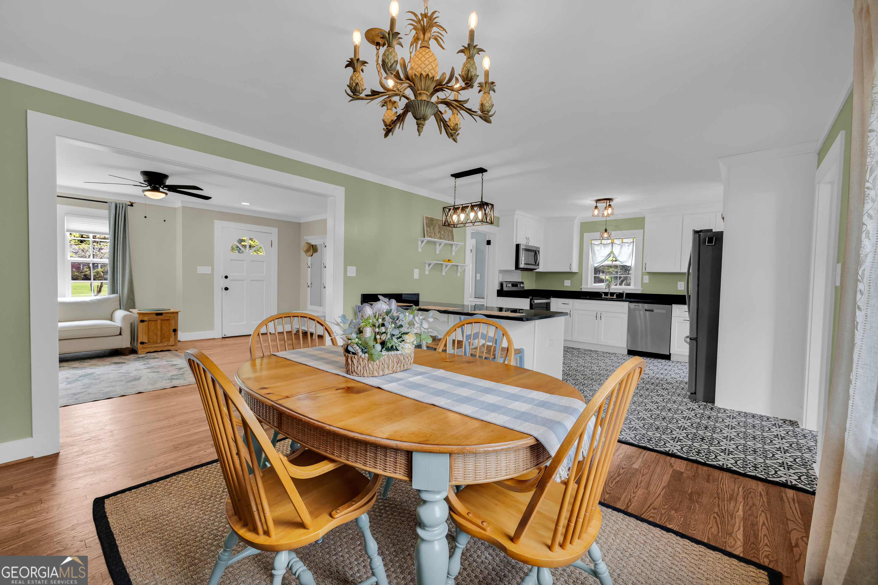 261 Oak Valley Road Toccoa, GA 30577 - Photo 18 of 52 a view of a dining room with furniture and a chandelier