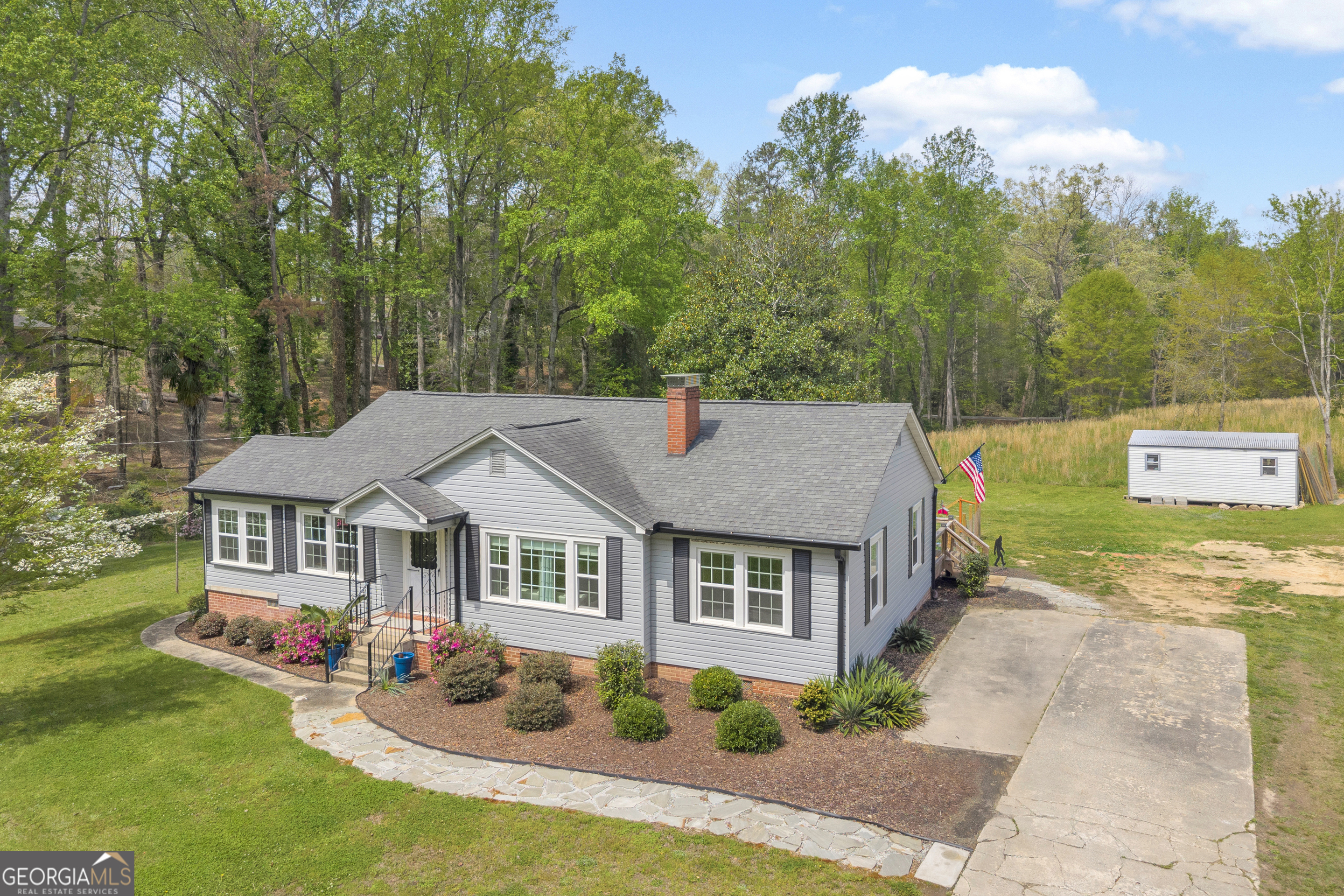 261 Oak Valley Road Toccoa, GA 30577 - Photo 2 of 52 a aerial view of a house with garden