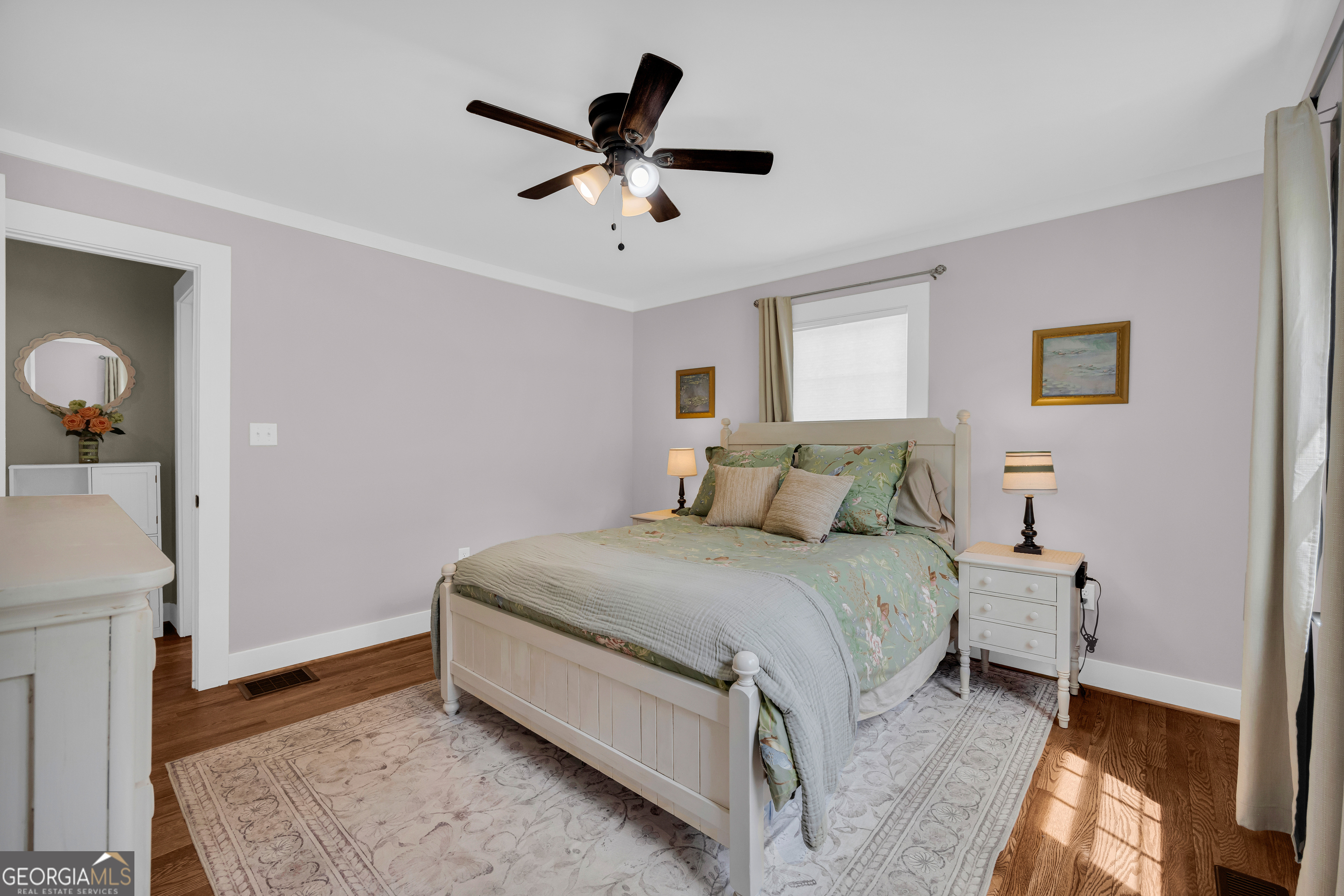 261 Oak Valley Road Toccoa, GA 30577 - Photo 26 of 52 a bed room with a bed and a chandelier