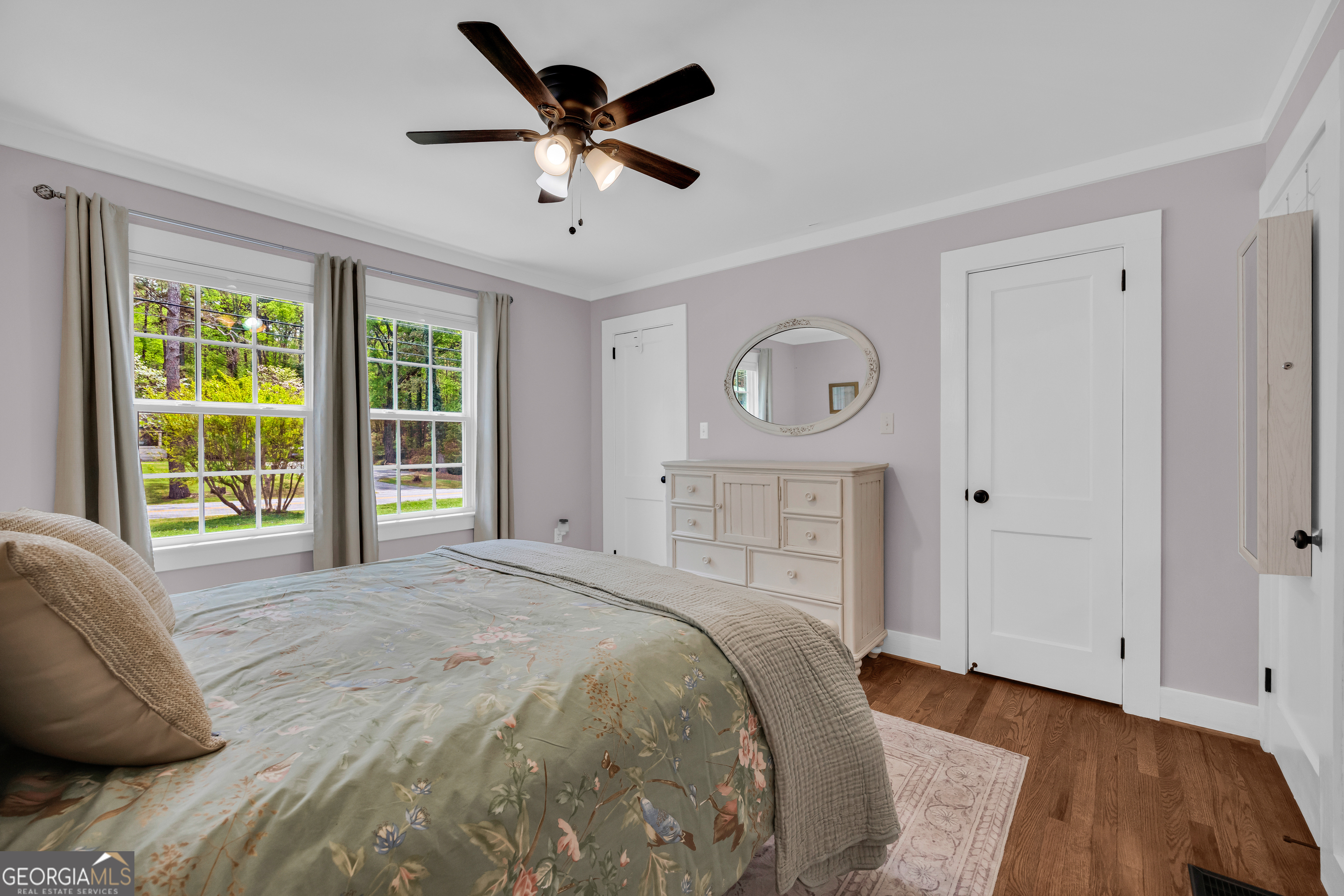 261 Oak Valley Road Toccoa, GA 30577 - Photo 27 of 52 a spacious bedroom with a large bed and a window