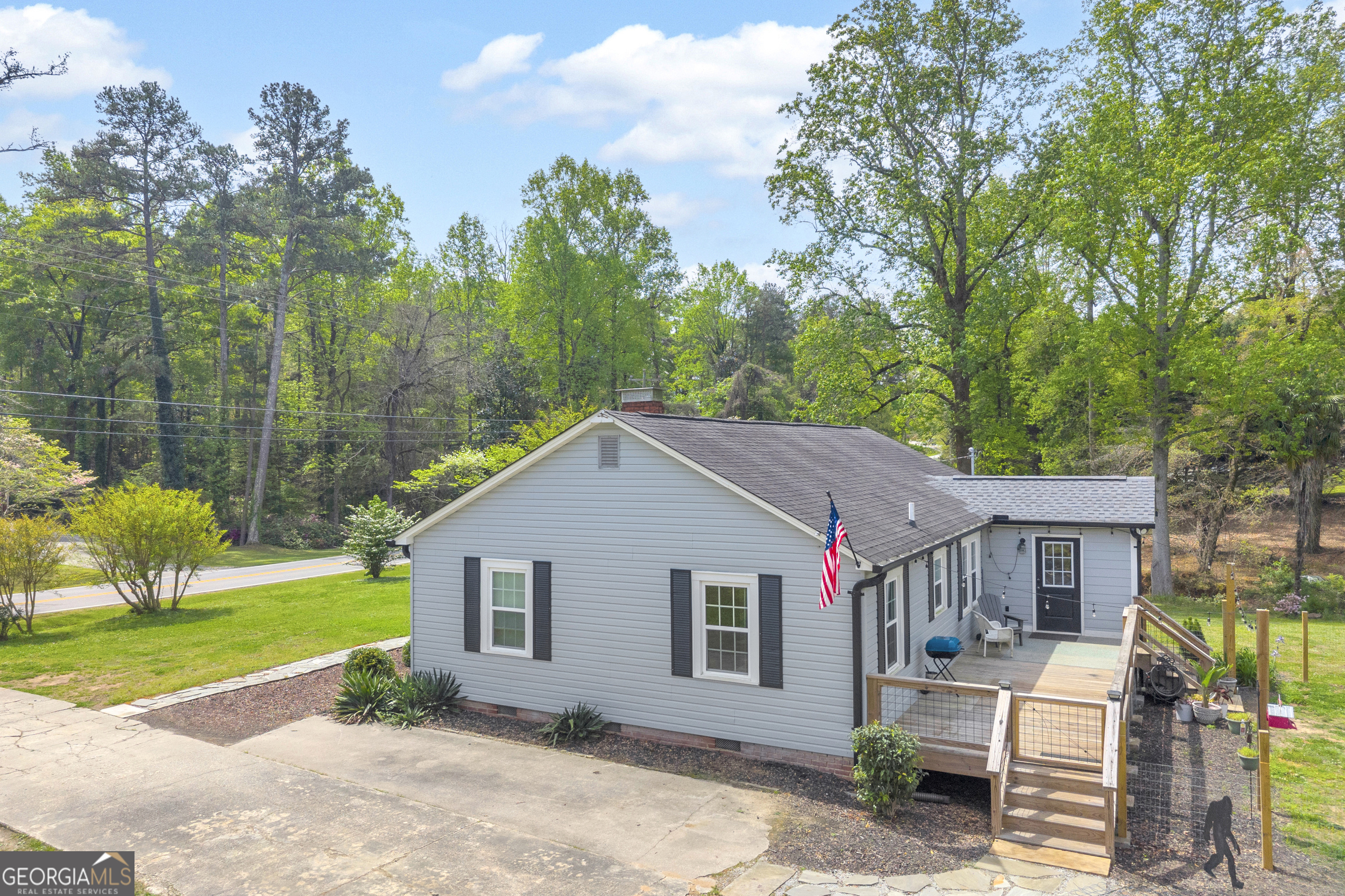 261 Oak Valley Road Toccoa, GA 30577 - Photo 39 of 52 a house that has a tree in front of it