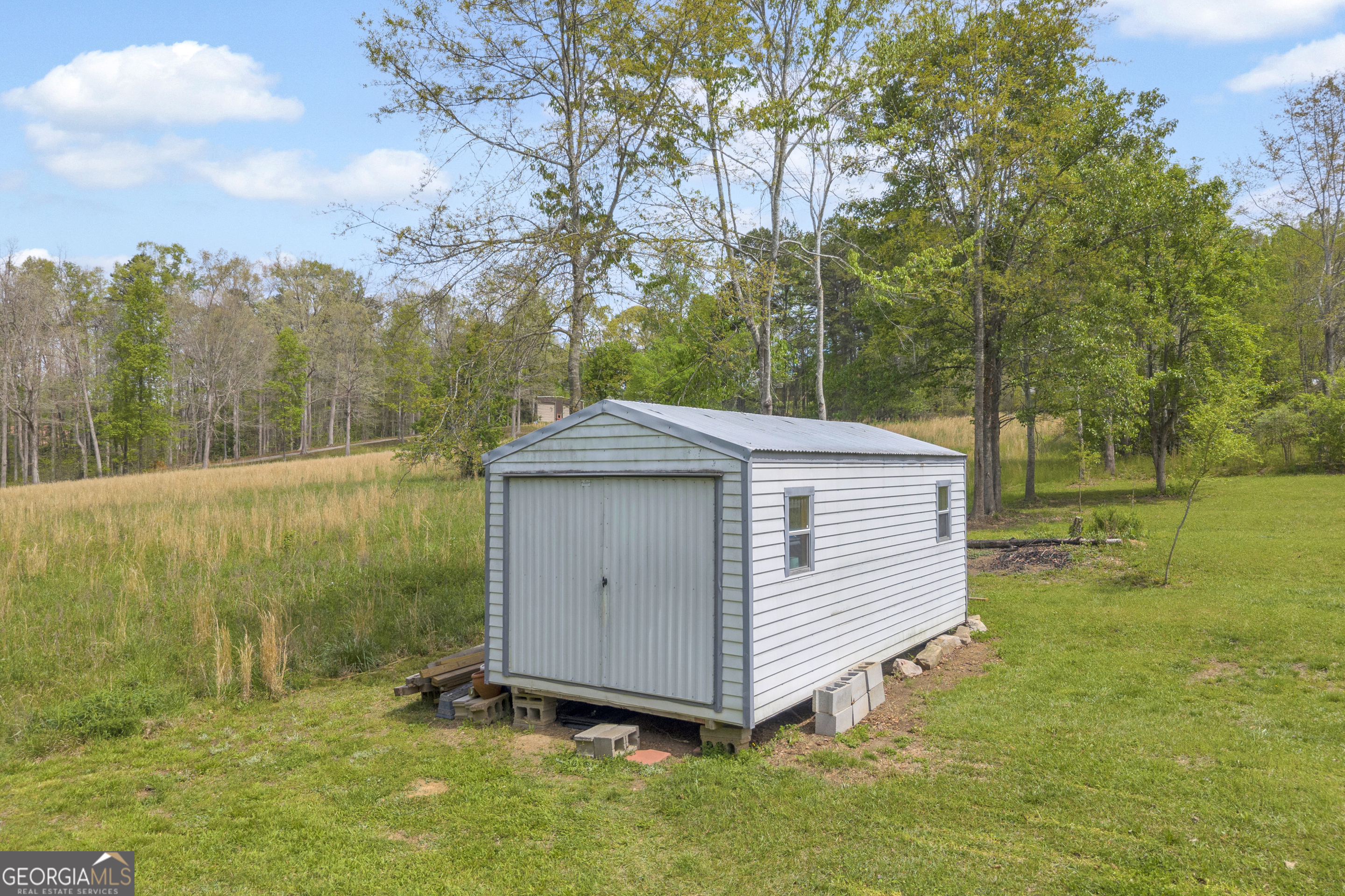 261 Oak Valley Road Toccoa, GA 30577 - Photo 40 of 52 a view of a backyard with a cabin