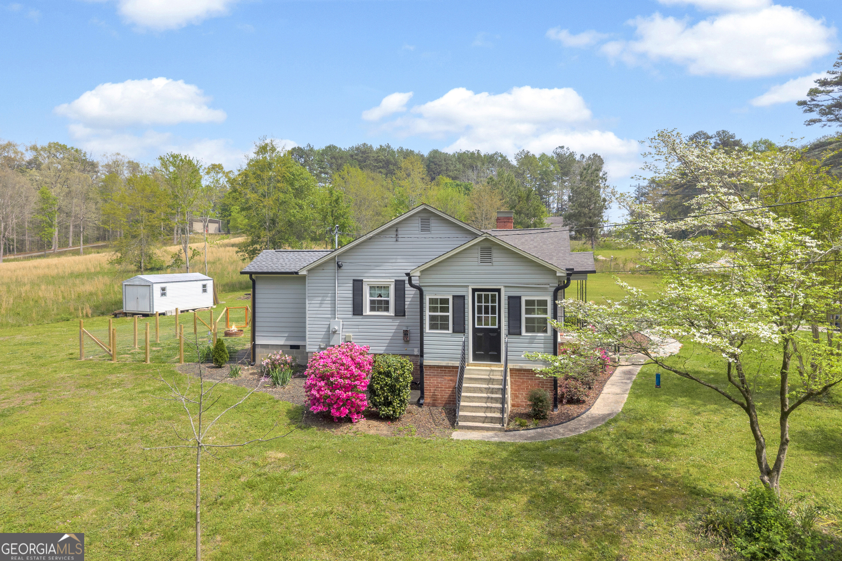 261 Oak Valley Road Toccoa, GA 30577 - Photo 43 of 52 a view of a house with a big yard and potted plants