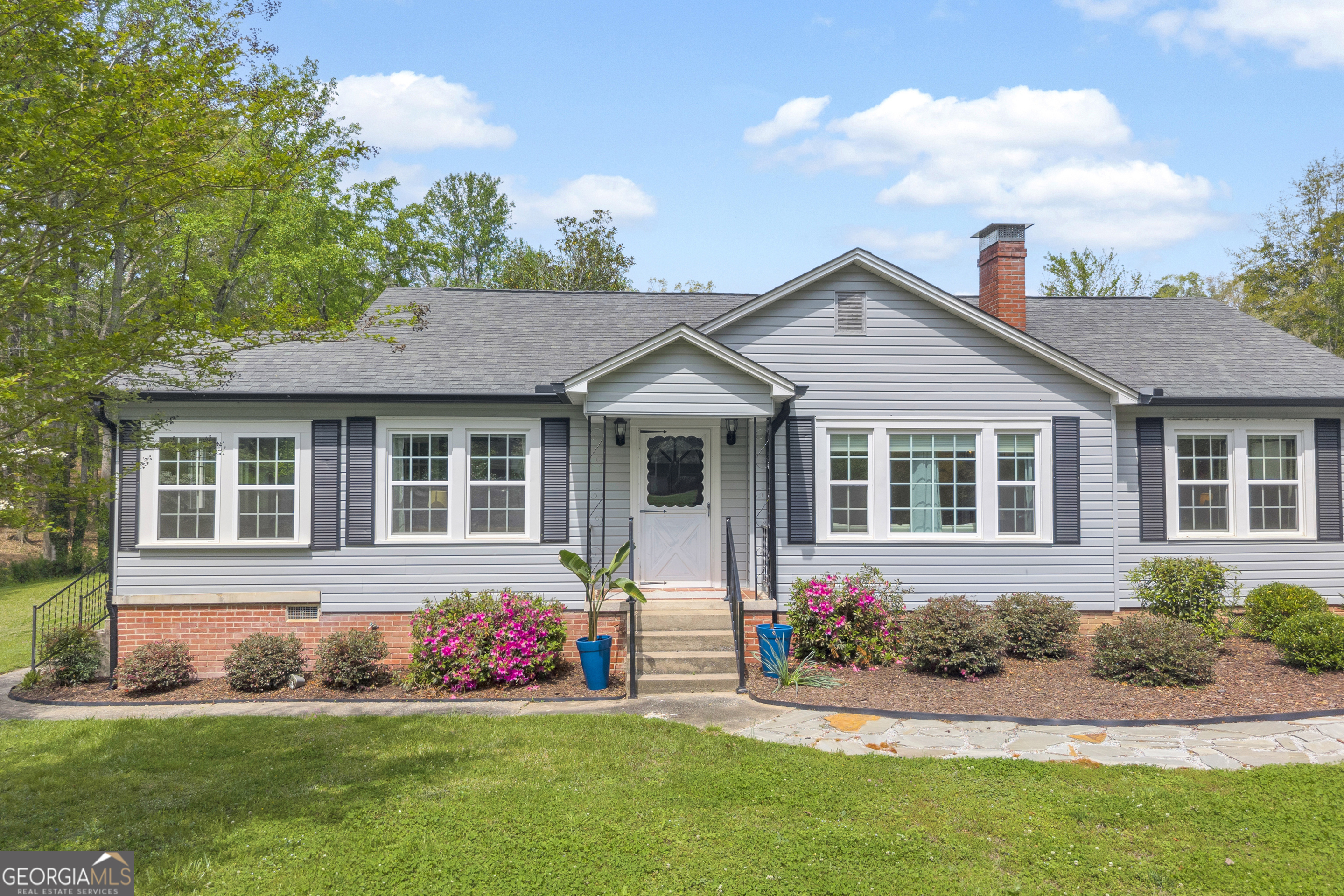 261 Oak Valley Road Toccoa, GA 30577 - Photo 5 of 52 a front view of a house with a yard