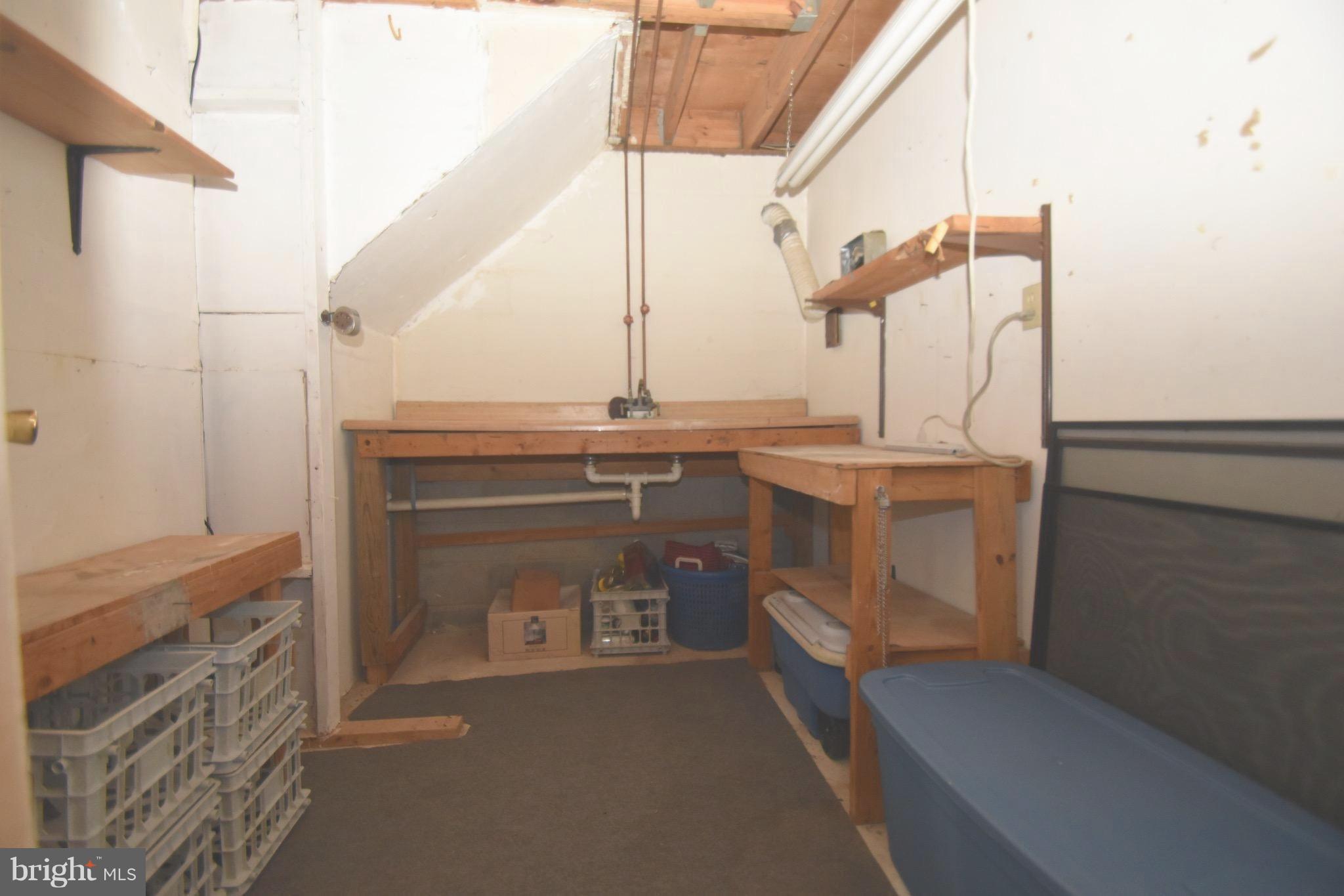 5638 Prince George Street Baltimore, MD 21207 - Photo 13 of 15 a utility room with a sink dryer and washer