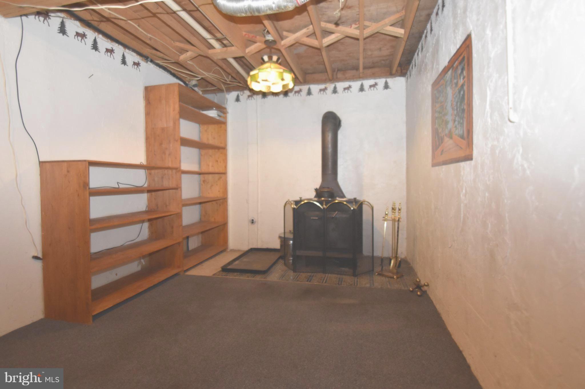 5638 Prince George Street Baltimore, MD 21207 - Photo 14 of 15 a view of empty room with windows