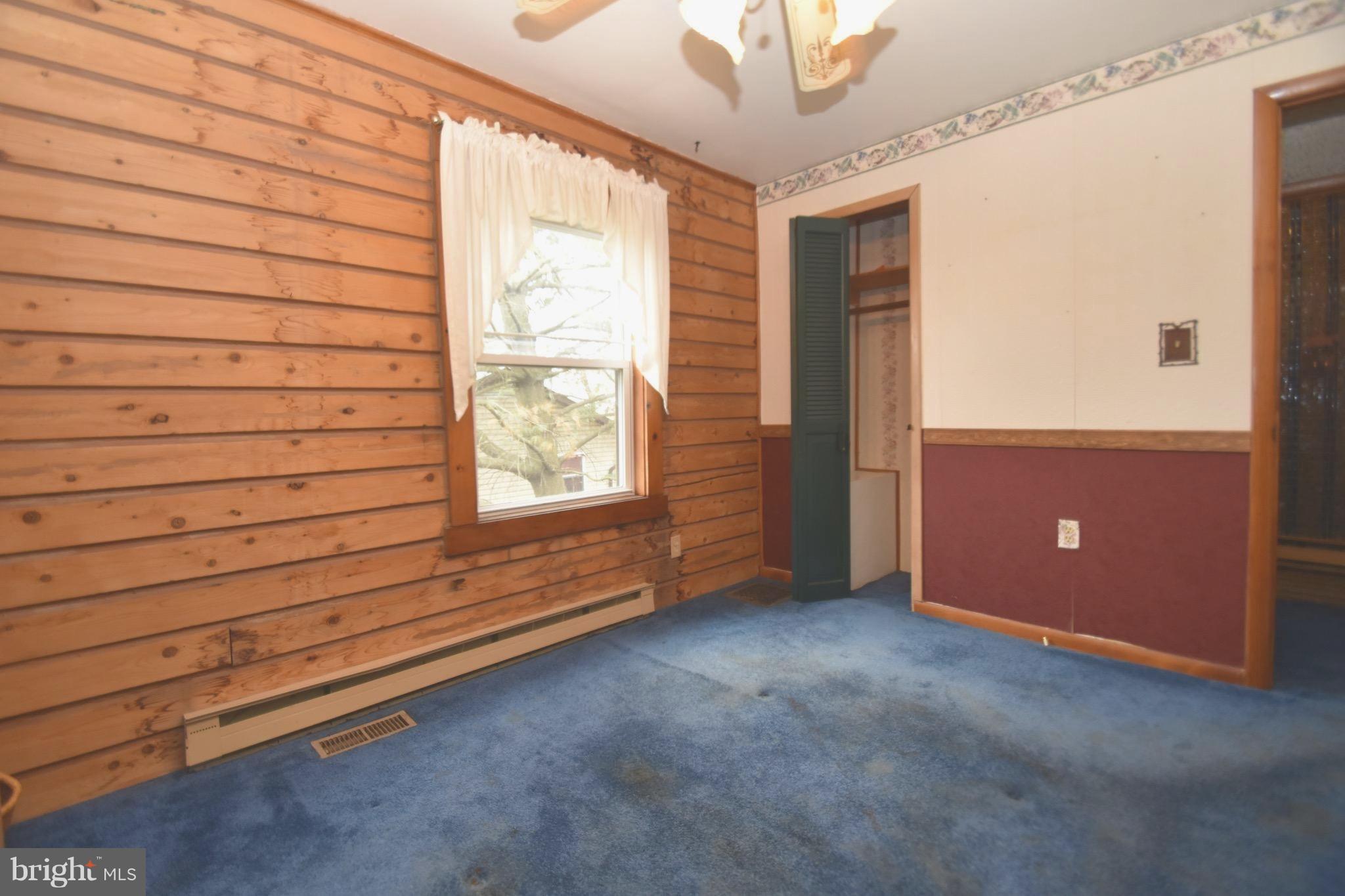 5638 Prince George Street Baltimore, MD 21207 - Photo 8 of 15 a view of an empty room with a window