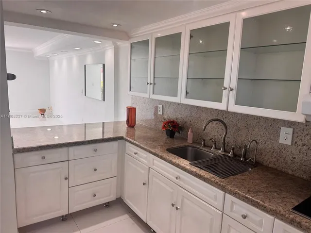 a view of a room with wooden floor and windows