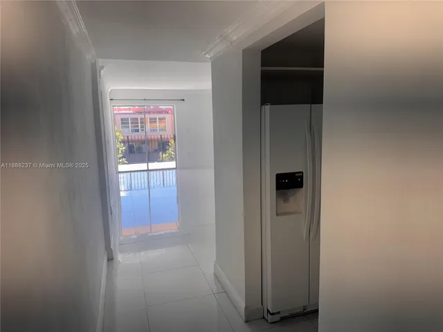 a kitchen with granite countertop a sink a stove and cabinets