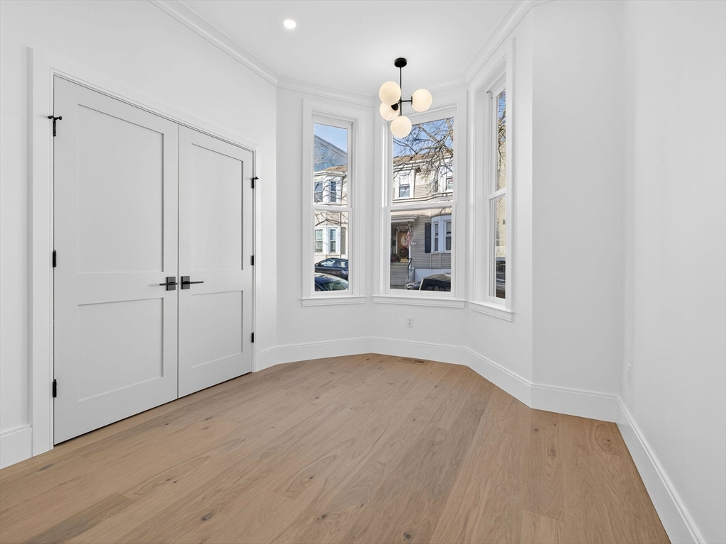427 East 6th Street, Unit 1 Boston, MA 02127 - Photo 12 of 30 an empty room with windows