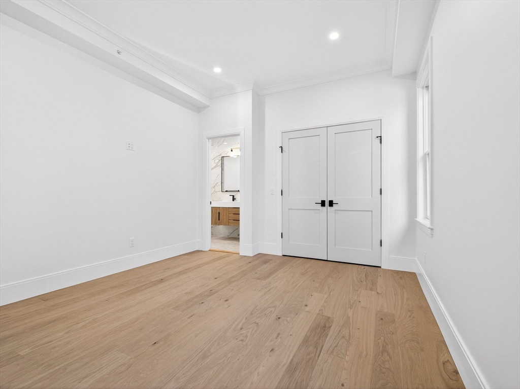 427 East 6th Street, Unit 1 Boston, MA 02127 - Photo 17 of 30 wooden floor in an empty room