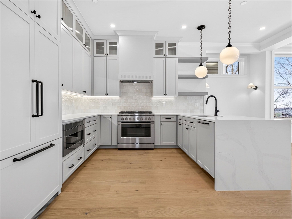 427 East 6th Street, Unit 1 Boston, MA 02127 - Photo 2 of 30 a large kitchen with cabinets a sink and appliances