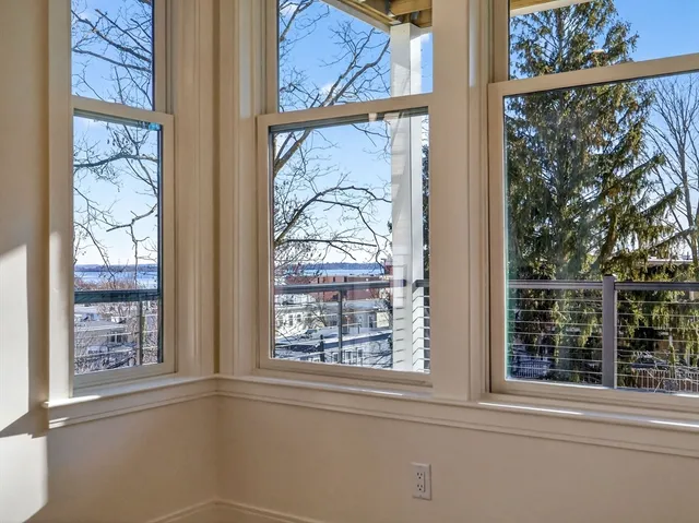 a view of kitchen and hall with wooden floor