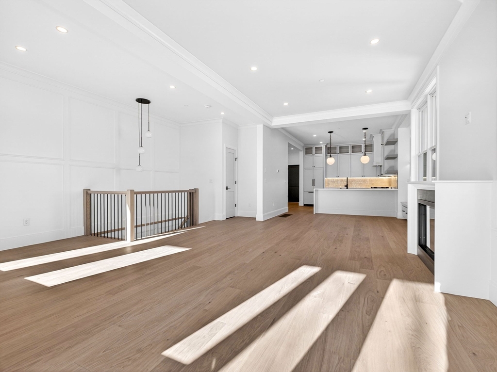 427 East 6th Street, Unit 1 Boston, MA 02127 - Photo 10 of 30 a view of kitchen and hall with wooden floor