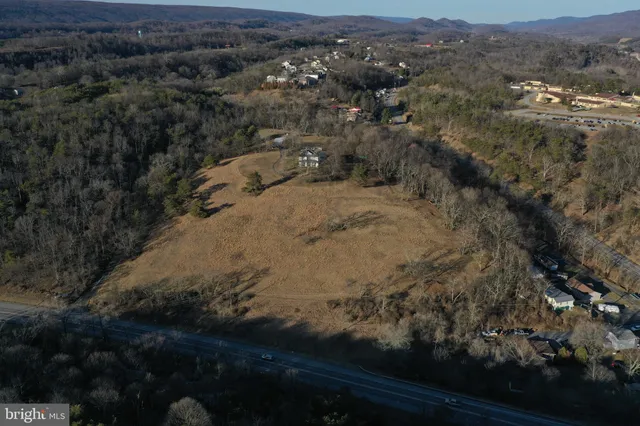 an aerial view of house with yard