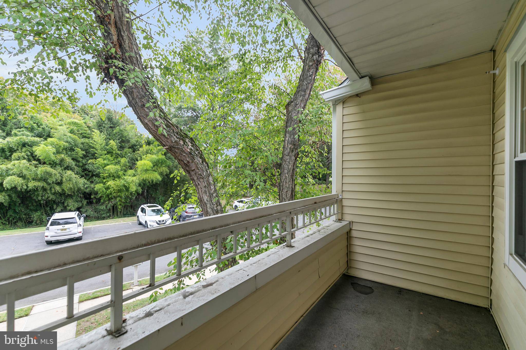 5 Mill Run West, Unit 5 Hightstown, NJ 08520 - Photo 4 of 26 a view of a two chair in the balcony