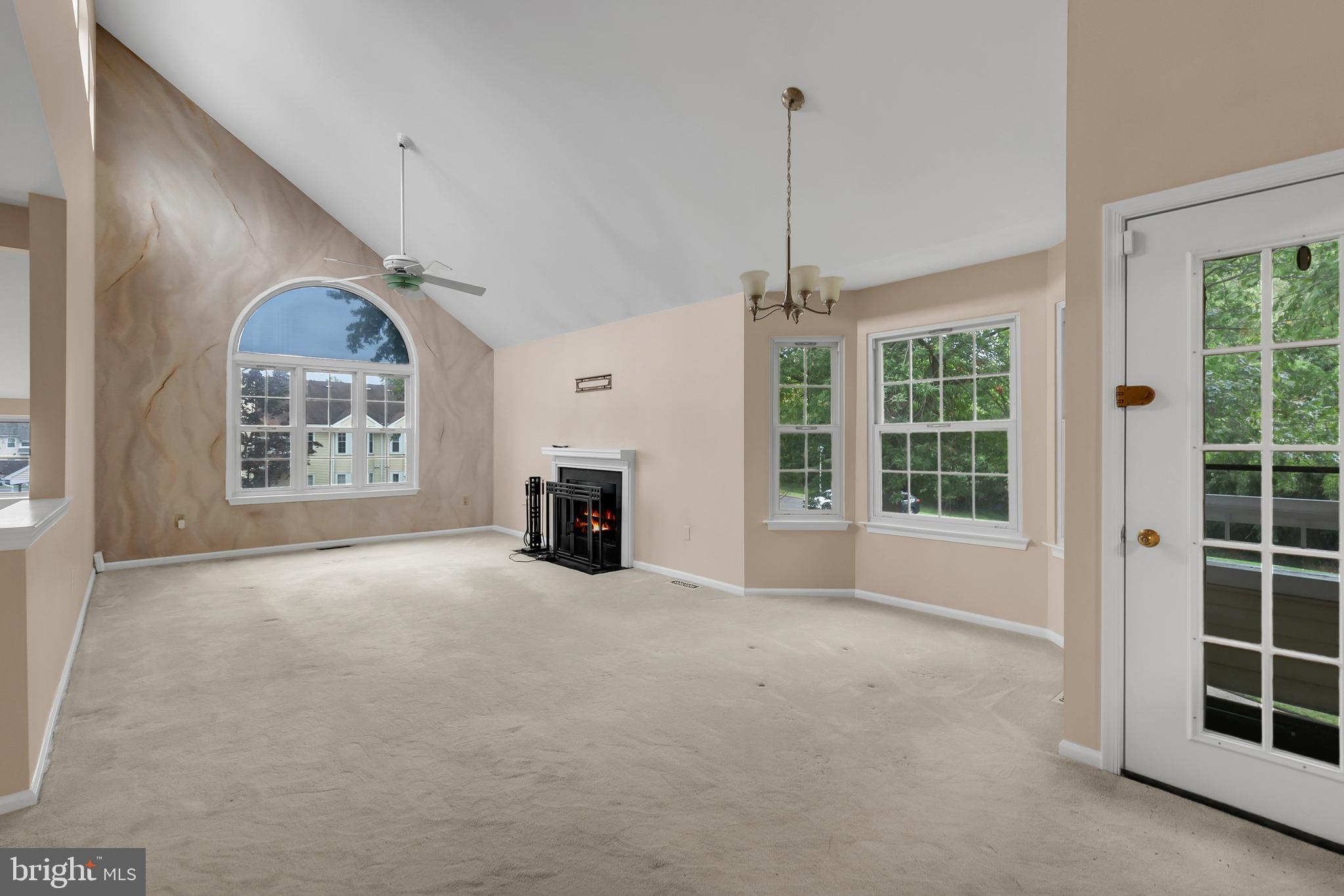 5 Mill Run West, Unit 5 Hightstown, NJ 08520 - Photo 8 of 26 a view of an empty room with a window and fireplace