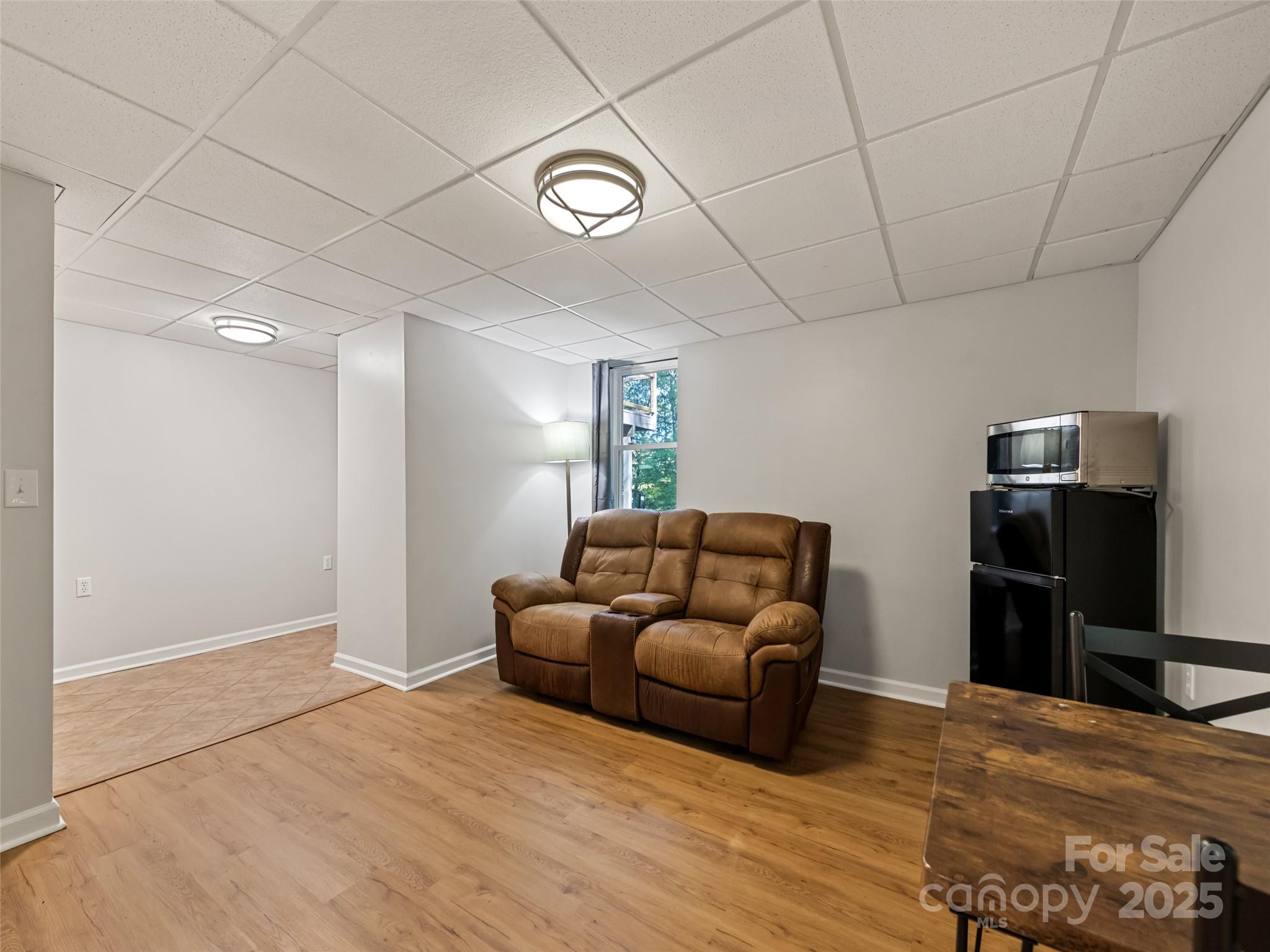 263 Blanton Street Columbus, NC 28722 - Photo 34 of 45 a living room with furniture and a flat screen tv