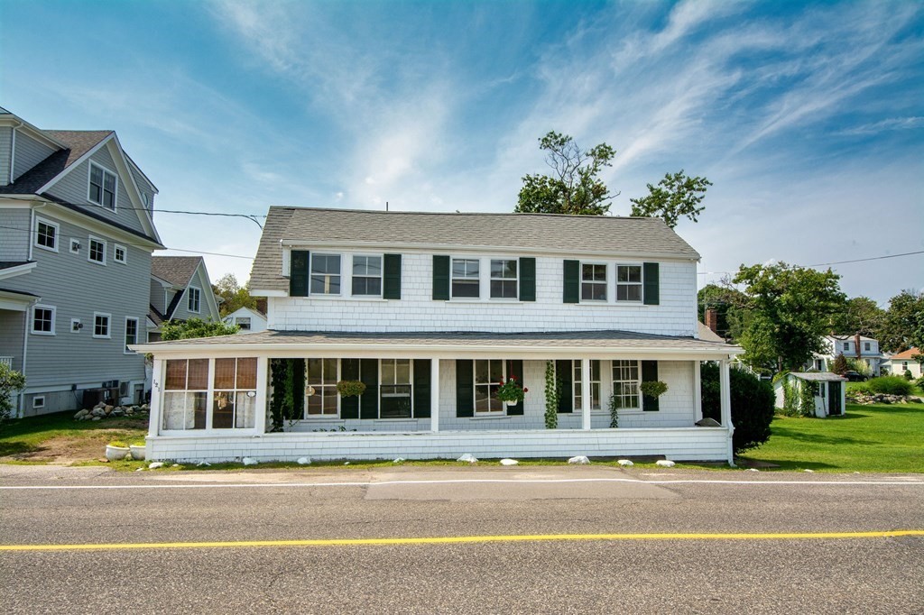 121 Jericho Road Scituate, MA 02066 - Photo 1 of 8 a front view of residential houses with yard