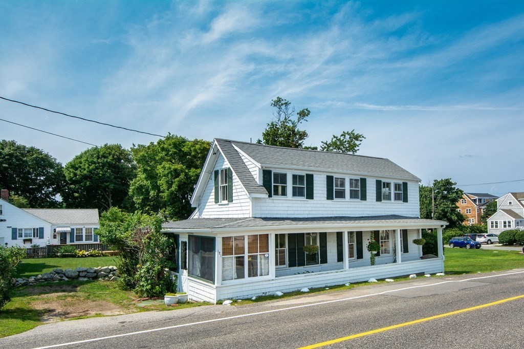 121 Jericho Road Scituate, MA 02066 - Photo 2 of 8 a front view of a house with a garden