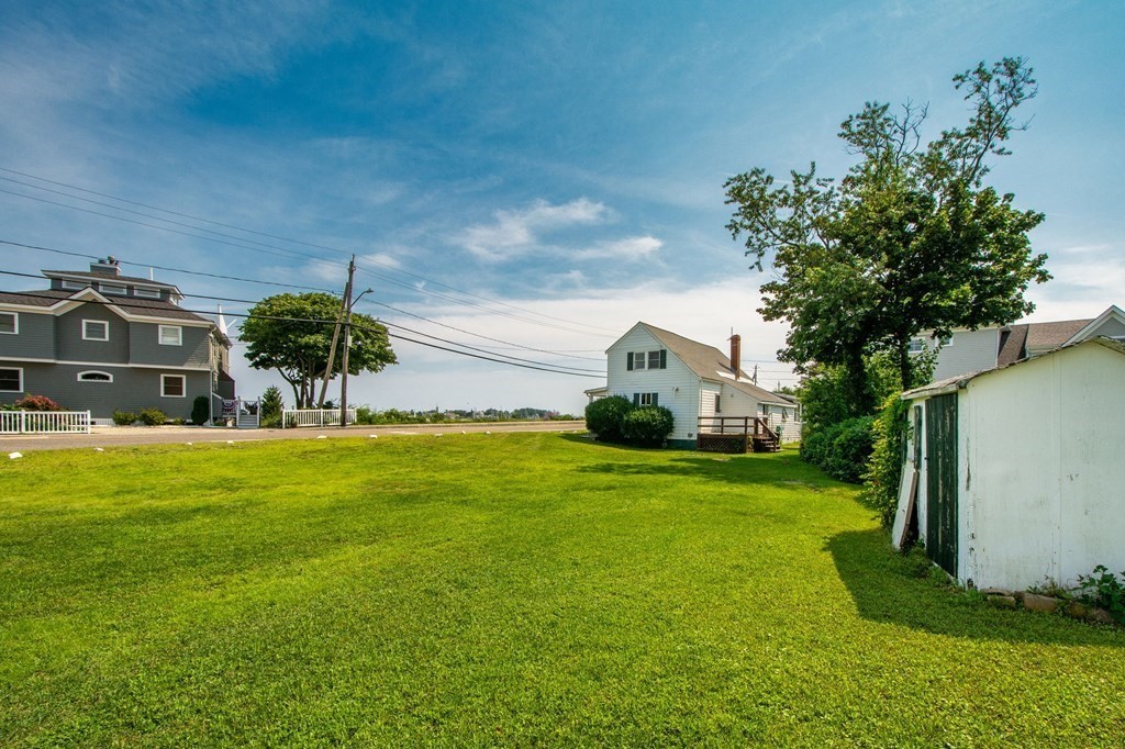 121 Jericho Road Scituate, MA 02066 - Photo 4 of 8 a front view of a house with garden