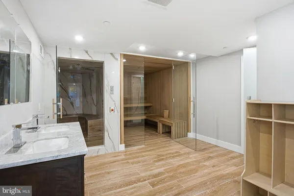 a view of walk in closet with empty racks