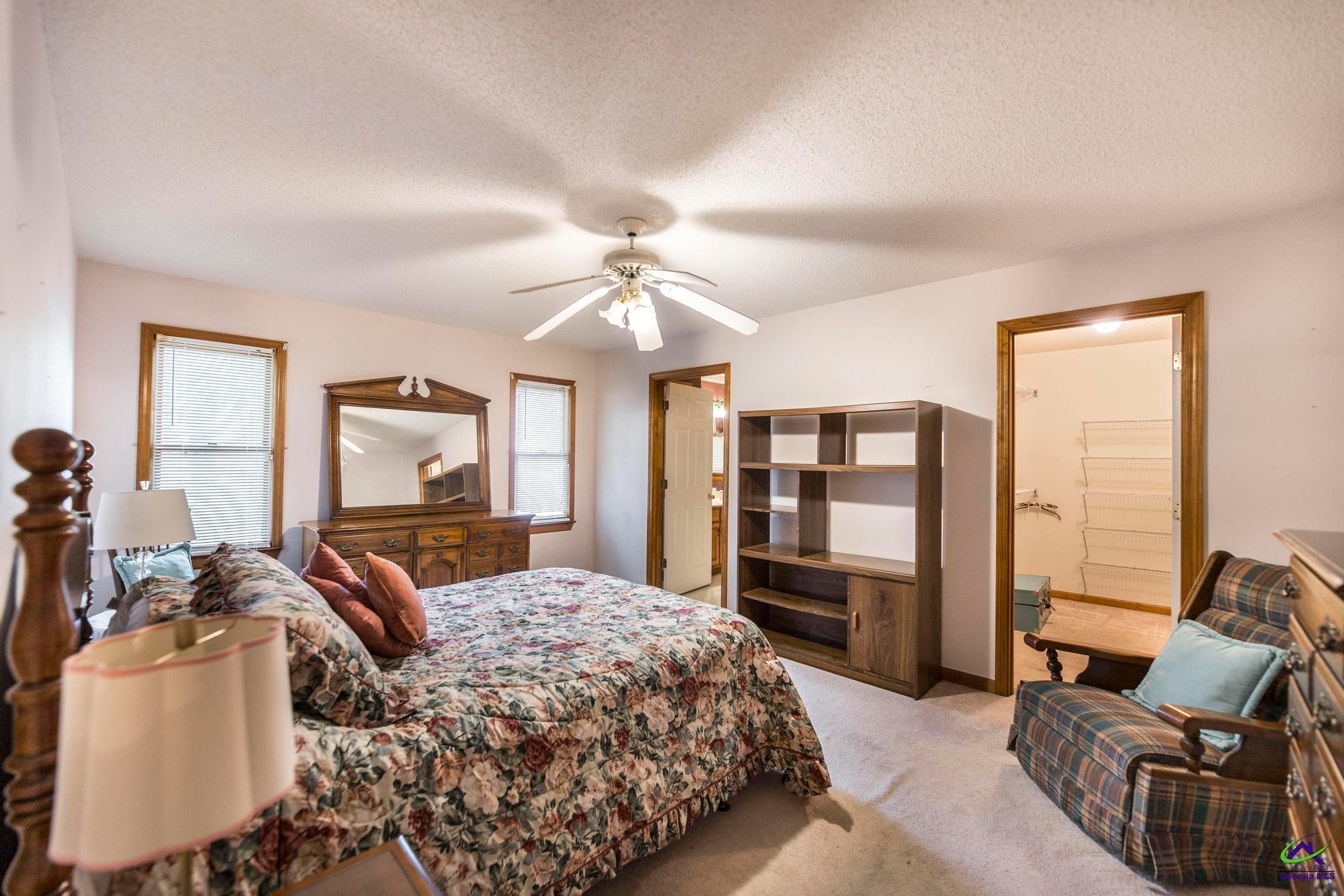 5731 School Road Macon, GA 31216 - Photo 18 of 33 Comfortable primary bedroom designed as a private retreat.