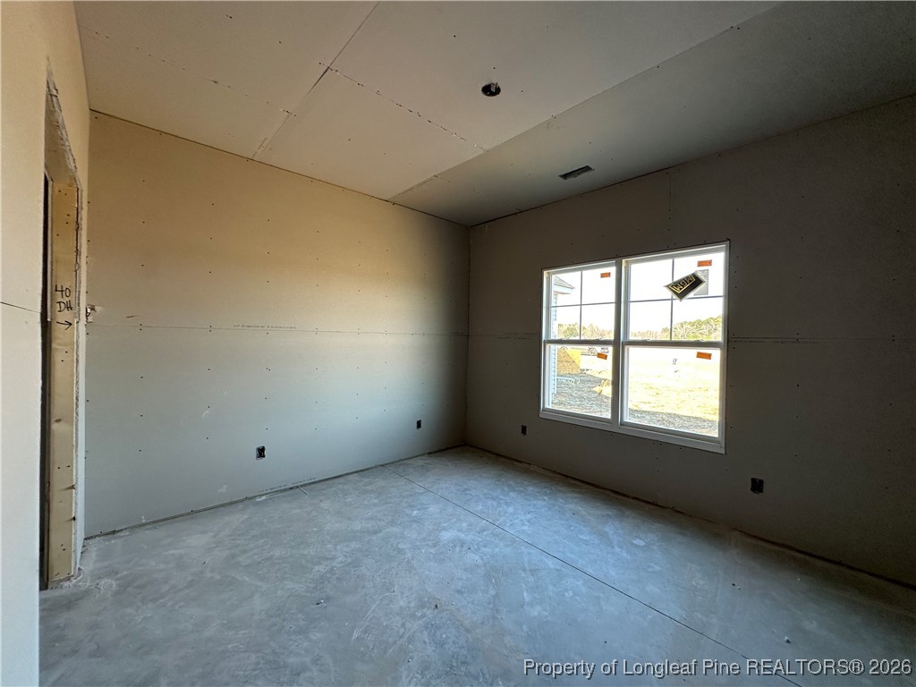 8405 Shannon Road Shannon, NC 28386 - Photo 7 of 12 a view of an empty room with a window