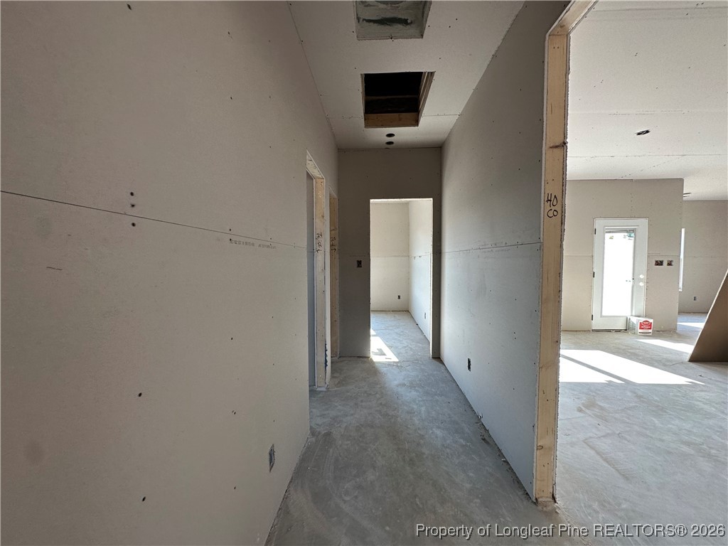 8405 Shannon Road Shannon, NC 28386 - Photo 8 of 12 a view of a hallway with wooden floor