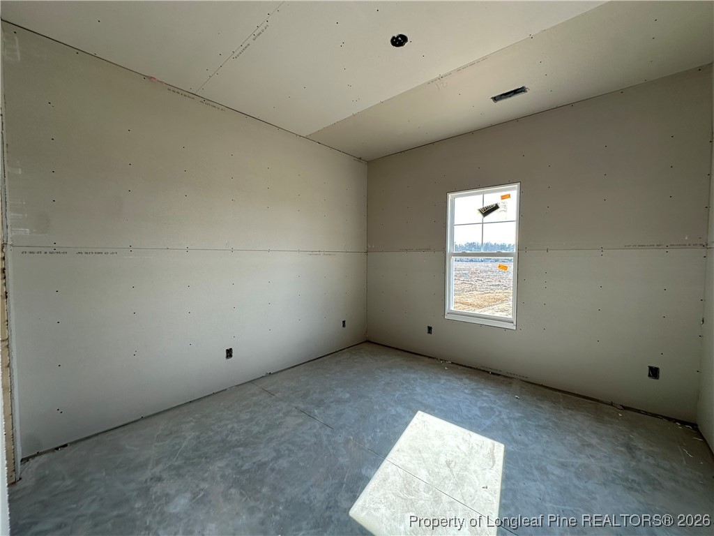 8405 Shannon Road Shannon, NC 28386 - Photo 10 of 12 an empty room with a window