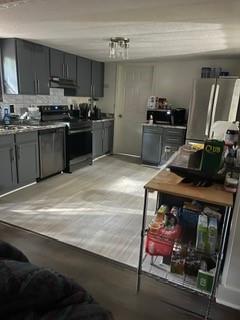 1184 Robert Hardeman Road Winterville, GA 30683 - Photo 12 of 20 a kitchen with stainless steel appliances granite countertop a stove refrigerator sink and cabinets