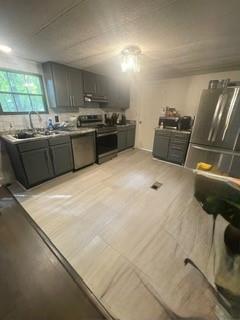 1184 Robert Hardeman Road Winterville, GA 30683 - Photo 14 of 20 a kitchen with stainless steel appliances granite countertop a sink a stove and a refrigerator