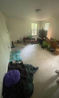 1184 Robert Hardeman Road Winterville, GA 30683 - Photo 18 of 20 a living room with furniture and a chandelier