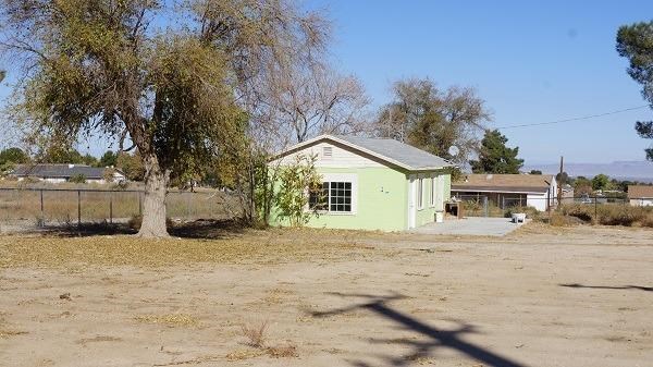 4540 Nielson Road Phelan, CA 92371 - Photo 1 of 1 a view of house with yard and trees in the background