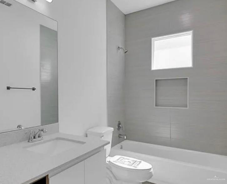 1403 Marcela Drive, Unit 1 Weslaco, TX 78599 - Photo 10 of 13 Full bath featuring vanity and bathtub / shower combination