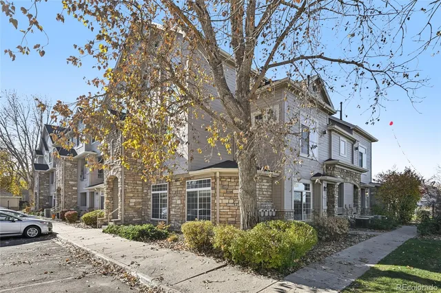 a view of a building with a yard