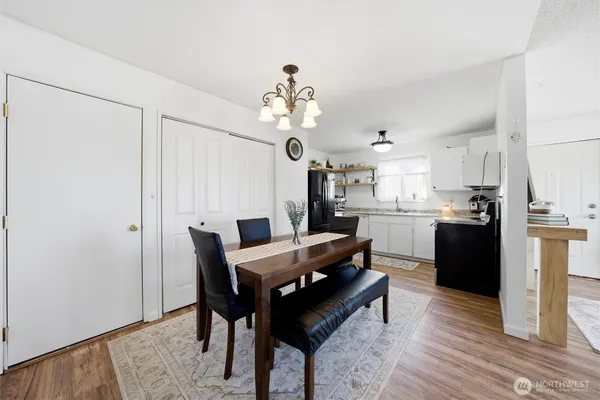 a view of a dining room with furniture and wooden floor