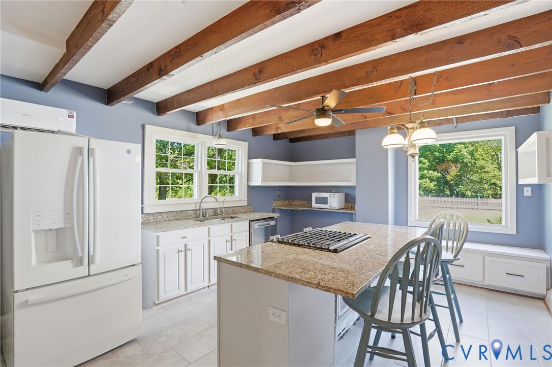 2297 Indian Oak Road Crewe, VA 23930 - Photo 20 of 53 a kitchen with a table chairs and a stove