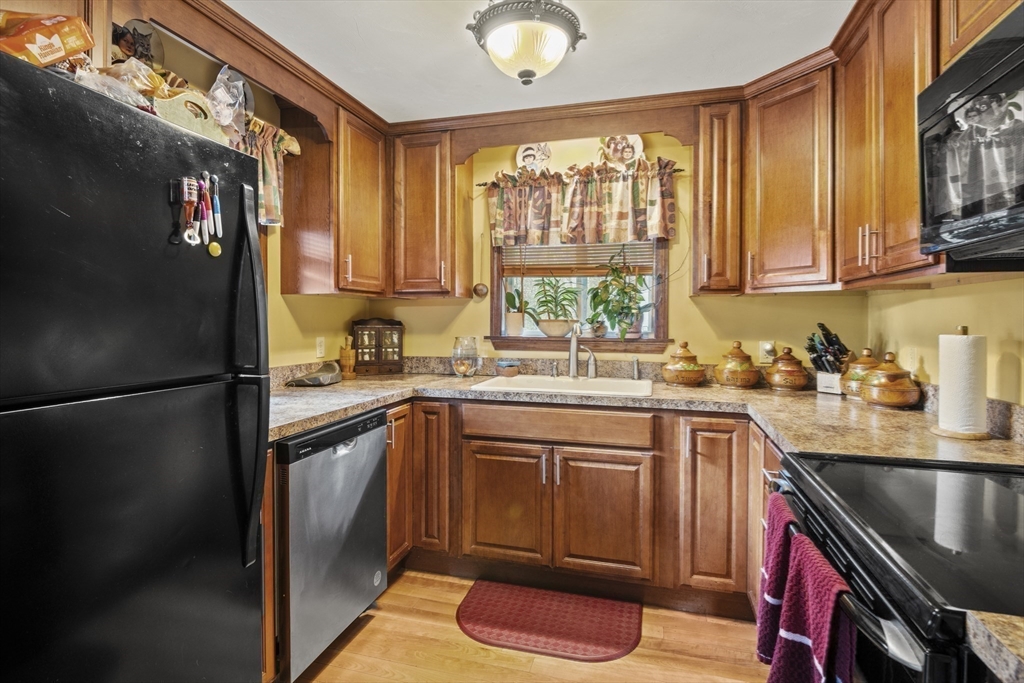 4 Wilson Way Rutland, MA 01543 - Photo 13 of 32 a kitchen with a window a sink and a refrigerator